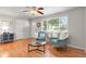 Bright living room with hardwood floors, comfortable seating, and a large window with natural light at 602 Birch St, Broomfield, CO 80020