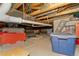 Basement featuring exposed pipes and storage containers at 8189 E 29Th Ave, Denver, CO 80238