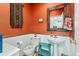 Unique bathroom with decorative mirror, colorful walls, and eclectic decor at 8189 E 29Th Ave, Denver, CO 80238