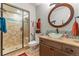 Bathroom with walk-in shower and glass bowl sink at 8189 E 29Th Ave, Denver, CO 80238