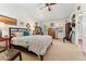 Spacious bedroom with vaulted ceilings and ample natural light from large windows at 8189 E 29Th Ave, Denver, CO 80238