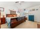 Bright bedroom with a large bed, dresser, and unique decor at 8189 E 29Th Ave, Denver, CO 80238