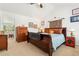 Comfortable bedroom featuring a large bed, dresser, and stylish decor at 8189 E 29Th Ave, Denver, CO 80238