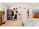 Large bedroom with neutral carpet, vaulted ceiling, and closet or ensuite bathroom at 8189 E 29Th Ave, Denver, CO 80238