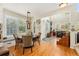Bright dining area with large windows, hardwood floors, and seating at 8189 E 29Th Ave, Denver, CO 80238