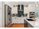 Lovely kitchen with a center island, stainless appliances, and open layout at 8189 E 29Th Ave, Denver, CO 80238