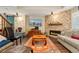Living room featuring a fireplace and mounted television at 8189 E 29Th Ave, Denver, CO 80238