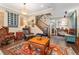 Cozy living room with wood floors and decorative rugs at 8189 E 29Th Ave, Denver, CO 80238