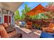 Outdoor patio with comfortable seating and shade umbrella at 8189 E 29Th Ave, Denver, CO 80238