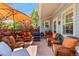 Outdoor patio area with ample seating and a shade umbrella at 8189 E 29Th Ave, Denver, CO 80238