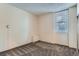 Bedroom featuring wall to wall carpet, baseboard heater, window with blinds and closet at 2225 Buchtel Blvd # 105, Denver, CO 80210