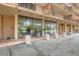 Ground level entrance of building with glass doors and beige painted cement walls at 2225 Buchtel Blvd # 105, Denver, CO 80210