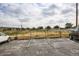 Outdoor parking lot with visible parking space lines under a cloudy sky at 2225 Buchtel Blvd # 105, Denver, CO 80210