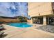 Outdoor pool, table and chair sets, and other exterior amenities at 2225 Buchtel Blvd # 105, Denver, CO 80210