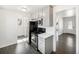 Modern kitchen with stainless steel appliances, gray cabinets, white countertops, and hardwood floors at 1654 Valentia St, Denver, CO 80220