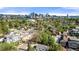 Aerial view shows the house, surrounding neighborhood and the cityscape in the distance at 3925 Pecos St, Denver, CO 80211