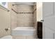 Bathroom featuring tiled shower over tub combination, tiled floor and vanity cabinet at 3925 Pecos St, Denver, CO 80211