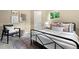 Bedroom with decor, carpet, window, a black metal bed and complementary decor at 3925 Pecos St, Denver, CO 80211