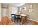 Dining room features a wooden table, rug, storage closet, and window allowing natural light at 3925 Pecos St, Denver, CO 80211