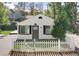 Charming home featuring a white picket fence and well-manicured landscaping at 3925 Pecos St, Denver, CO 80211