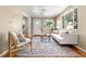 Bright living room features hardwood floors and neutral-toned contemporary furniture at 3925 Pecos St, Denver, CO 80211