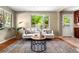 Bright living room features a large window, hardwood floors, and modern furniture at 3925 Pecos St, Denver, CO 80211
