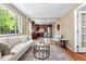 Bright living room features a large window, hardwood floors, and modern furniture at 3925 Pecos St, Denver, CO 80211