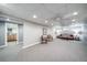 Spacious basement with recessed lighting, an open floor plan, and extra seating at 2424 S Jasmine St, Denver, CO 80222