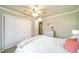 Inviting bedroom with a ceiling fan, neutral paint, and a closet at 2424 S Jasmine St, Denver, CO 80222