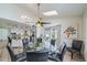 Cozy dining room features a modern fan, skylight, and access to the backyard at 2424 S Jasmine St, Denver, CO 80222