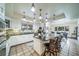 Sunlit kitchen featuring a large island, modern appliances, and stylish tile work at 2424 S Jasmine St, Denver, CO 80222