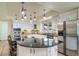 Bright kitchen with granite countertops, stainless steel appliances, and a center island at 2424 S Jasmine St, Denver, CO 80222