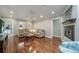 Cozy living room with hardwood floors, fireplace, and ample natural light creating an inviting atmosphere at 2424 S Jasmine St, Denver, CO 80222