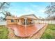 Brick patio area with an attached covered porch, and space for outdoor dining and entertaining at 2424 S Jasmine St, Denver, CO 80222