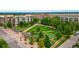 Aerial view of a community green space with lawn bowling, walking paths, and shade structures at 476 S Saulsbury St, Lakewood, CO 80226