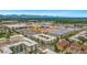 An aerial view showcasing the property's proximity to shopping centers, restaurants, and commercial buildings at 476 S Saulsbury St, Lakewood, CO 80226