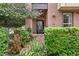 Charming front entrance to a brick townhouse featuring well-maintained landscaping at 476 S Saulsbury St, Lakewood, CO 80226