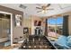 Entertaining game room featuring a foosball table, television, and access to an outdoor deck at 476 S Saulsbury St, Lakewood, CO 80226