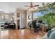 A spacious office area with hardwood floors, bright windows, and an efficient work setup, offering comfort and style at 476 S Saulsbury St, Lakewood, CO 80226