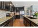 Modern kitchen featuring granite countertops, stainless steel appliances, and stylish backsplash at 476 S Saulsbury St, Lakewood, CO 80226