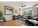 Spacious living room featuring hardwood floors, comfortable seating, and large windows at 476 S Saulsbury St, Lakewood, CO 80226