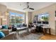 Bright living room featuring hardwood floors, ample natural light, and comfortable seating at 476 S Saulsbury St, Lakewood, CO 80226
