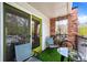 Private balcony with artificial turf and comfortable seating for relaxing outdoors at 1150 Inca St # 25, Denver, CO 80204