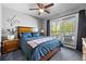 Bedroom featuring a ceiling fan, wooden bed frame, and access to a private balcony at 1150 Inca St # 25, Denver, CO 80204