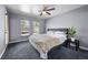Cozy bedroom featuring a ceiling fan, windows for natural light, and neutral color palette at 1150 Inca St # 25, Denver, CO 80204