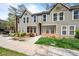 Charming townhome with landscaped front yard and inviting facade under a bright sky at 1150 Inca St # 25, Denver, CO 80204