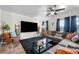 Inviting living room with modern furnishings, large TV, and ample natural light at 1150 Inca St # 25, Denver, CO 80204