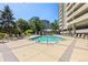 Outdoor pool with lounge chairs and surrounding greenery at 1150 Inca St # 25, Denver, CO 80204