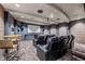 Home theater featuring comfortable seating, projector and screen for entertainment at 1150 Inca St # 25, Denver, CO 80204