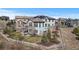 An aerial view of the house featuring solar panels, backyard and fence around the property at 1240 Starglow Pl, Highlands Ranch, CO 80126